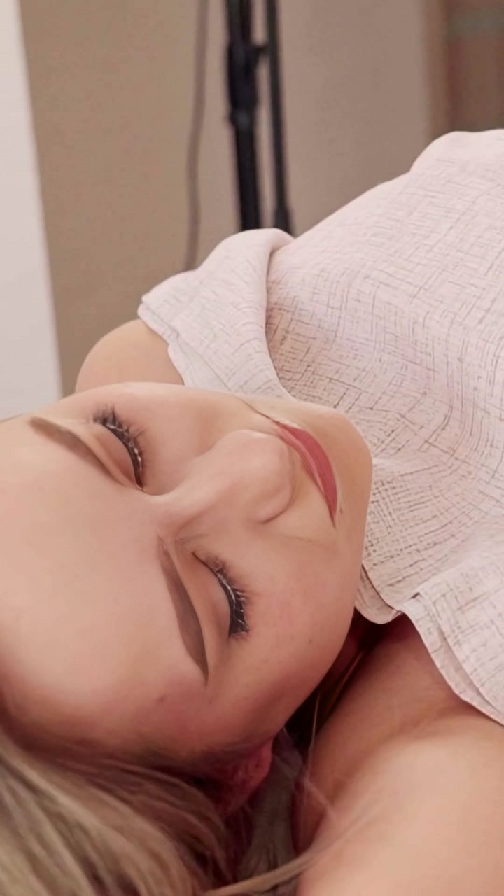 A client came in with chronic tension headaches and jaw clenching. We applied a gentle suboccipital release, using light pressure at the base of her skull to ease the deep neck muscles. This allows the entire face and scalp to soften, as you see here. She