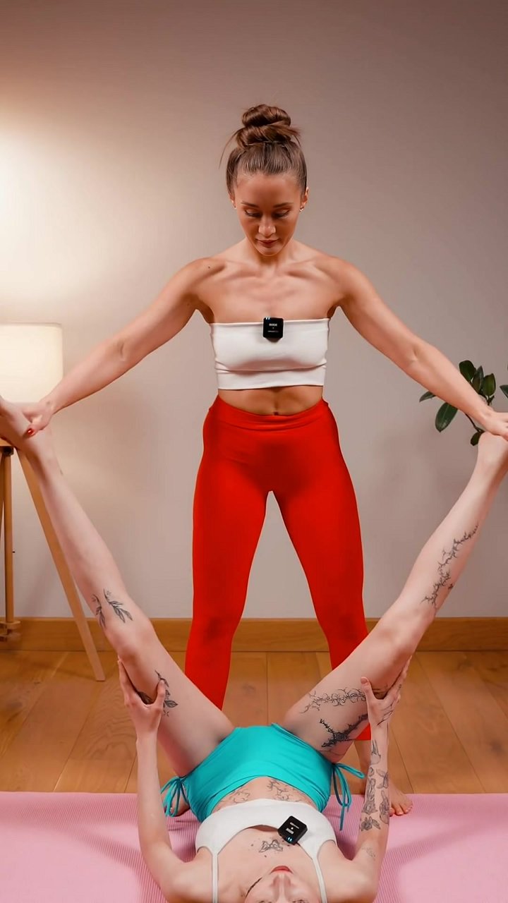 Do your hips feel locked and tight after sitting all day? This partner-assisted stretch targets deep hip tension. Your assistant holds both feet, slowly guiding the legs apart into a wide V-shape to lengthen the adductor muscles. The controlled return mot