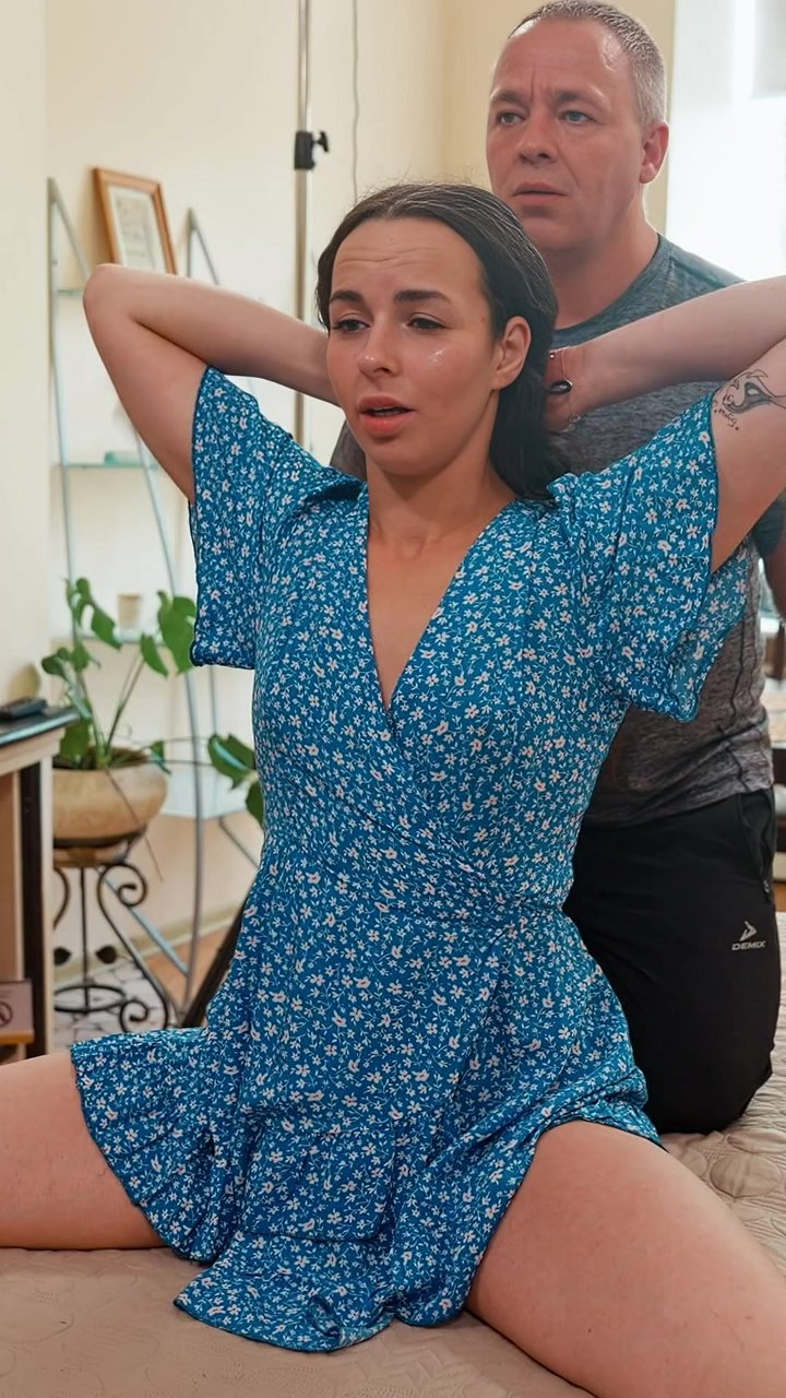 That wide-legged stretch you're doing is actually hurting your progress. By having a partner hold your arms overhead, you stabilize the spine and create an anchor. This allows for a deeper, safer release through the inner thighs and lower leg muscles with
